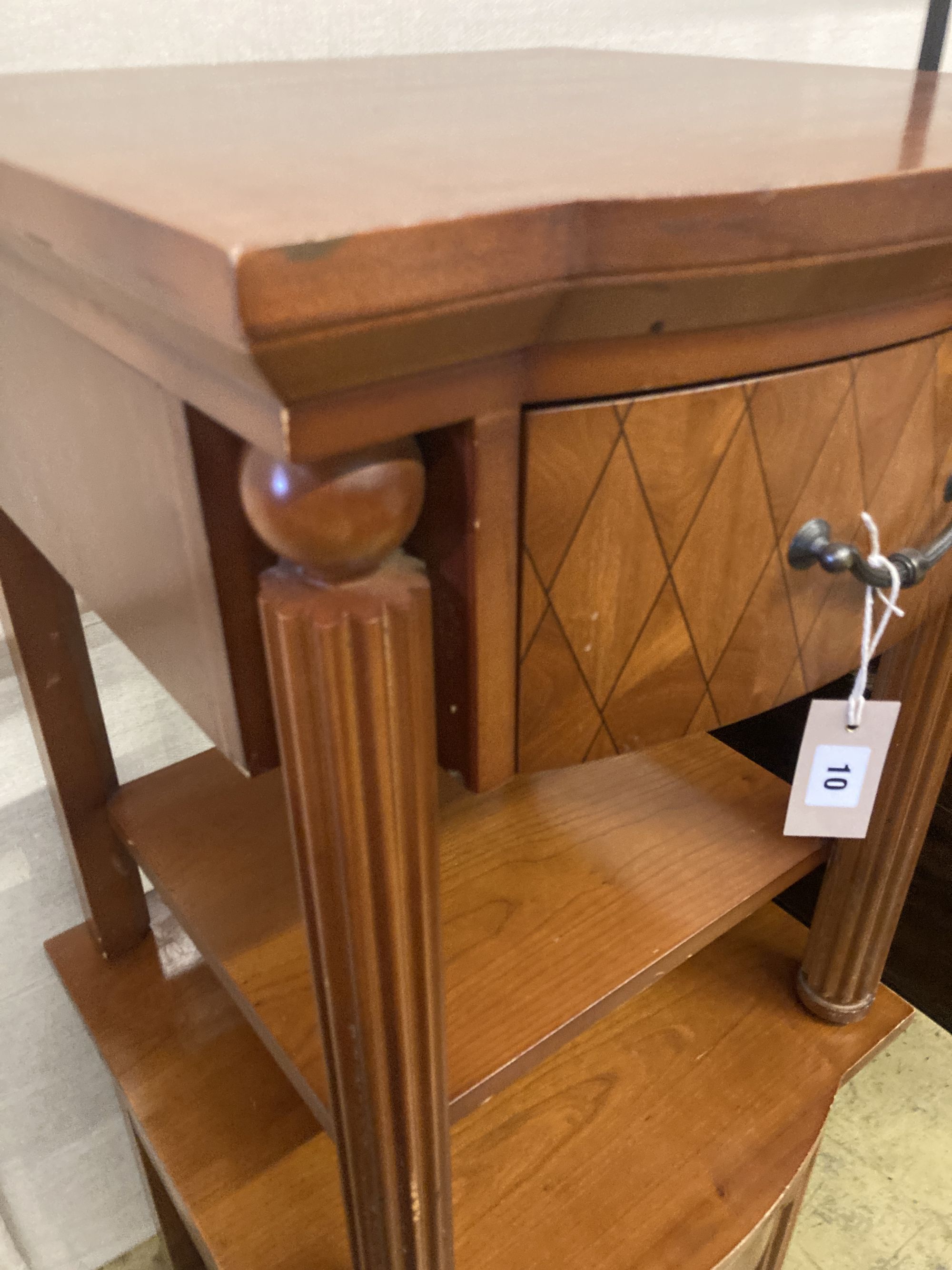 A pair of mahogany bow front bedside tables, width 50cm, depth 50cm, height 62cm